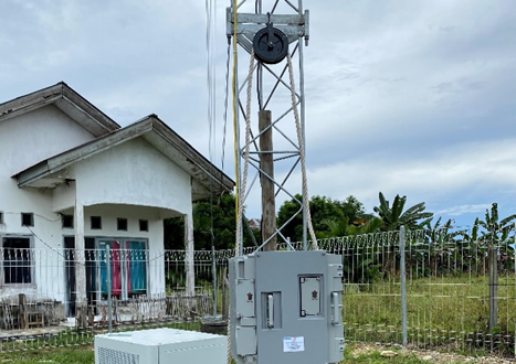 Tower with equipment cabinet